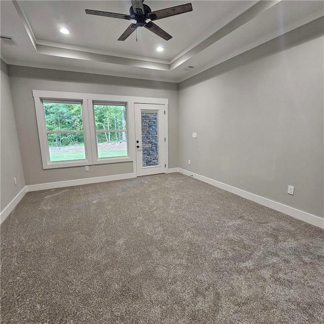 6093 Wayarer Dr, Villa Rica, GA 30180 - spare room with a tray ceiling, baseboards, ceiling fan, carpet, and recessed lighting