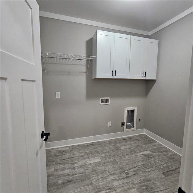 6093 Wayarer Dr, Villa Rica, GA 30180 - laundry area featuring washer hookup, hookup for an electric dryer, cabinet space, baseboards, and wood finished floors