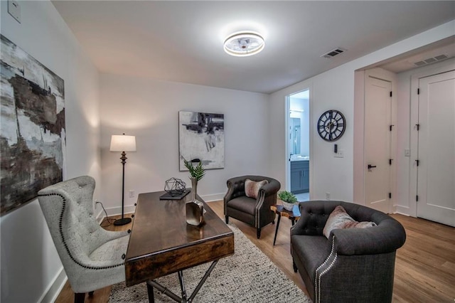 home office featuring light hardwood / wood-style floors