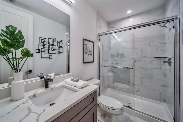 bathroom featuring toilet, an enclosed shower, and vanity