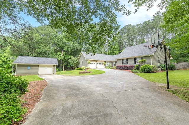 1667 Quail Run, Conyers, GA 30094 - ranch-style house featuring concrete driveway, an outdoor structure, view of scattered trees, and a garage