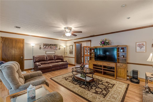 1667 Quail Run, Conyers, GA 30094 - living area featuring a ceiling fan, light wood finished floors, and ornamental molding