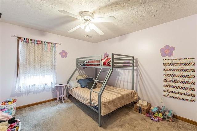 1667 Quail Run, Conyers, GA 30094 - bedroom featuring carpet flooring, a ceiling fan, and a textured ceiling