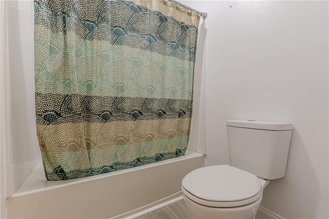 1667 Quail Run, Conyers, GA 30094 - bathroom with shower / bath combo with shower curtain and wood finished floors