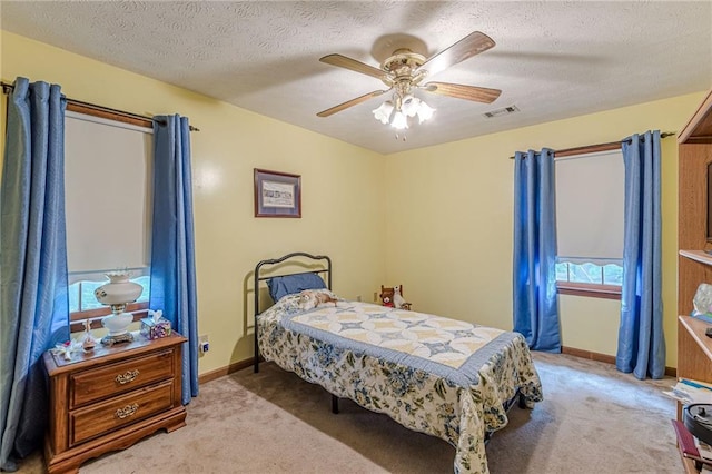 1667 Quail Run, Conyers, GA 30094 - carpeted bedroom with a ceiling fan and a textured ceiling