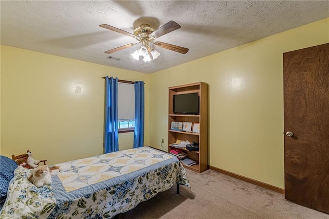 1667 Quail Run, Conyers, GA 30094 - bedroom featuring light carpet, a ceiling fan, and a textured ceiling
