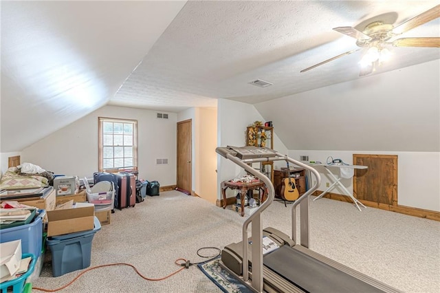 1667 Quail Run, Conyers, GA 30094 - exercise room featuring lofted ceiling, carpet flooring, and ceiling fan