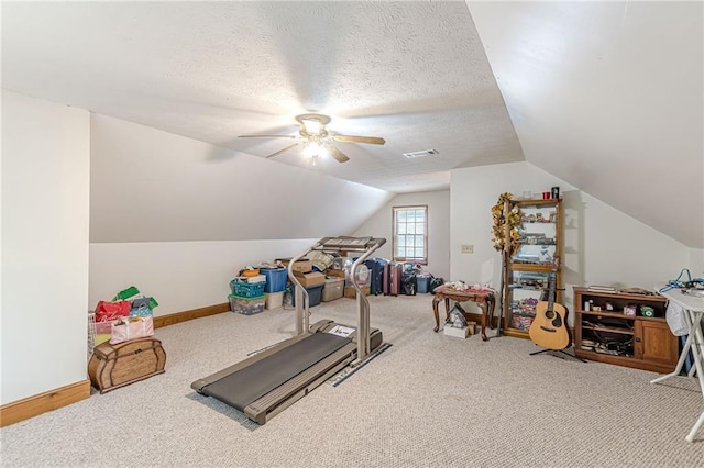1667 Quail Run, Conyers, GA 30094 - workout room featuring carpet flooring, vaulted ceiling, a ceiling fan, and a textured ceiling