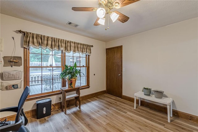 1667 Quail Run, Conyers, GA 30094 - office with light wood-type flooring, ceiling fan, and a textured ceiling
