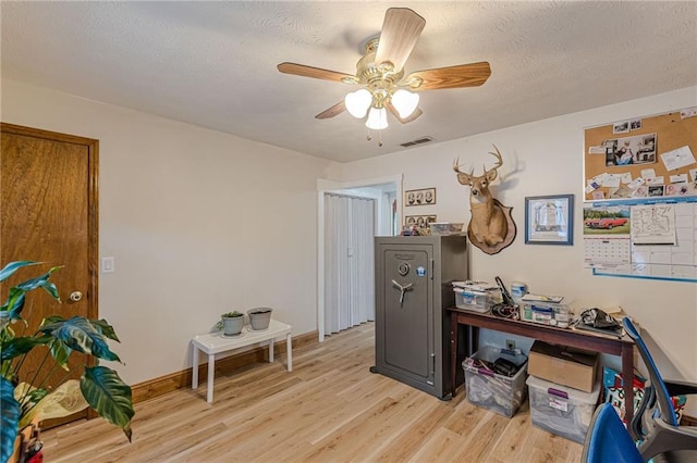 1667 Quail Run, Conyers, GA 30094 - home office featuring light wood-style flooring, a ceiling fan, and a textured ceiling