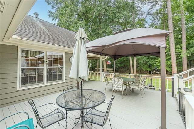 1667 Quail Run, Conyers, GA 30094 - deck with outdoor dining space and a gazebo
