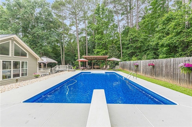 1667 Quail Run, Conyers, GA 30094 - view of pool with a gazebo, a fenced backyard, a diving board, and view of scattered trees