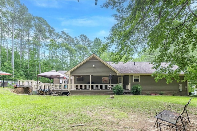 1667 Quail Run, Conyers, GA 30094 - rear view of property featuring a yard, a gazebo, and a deck