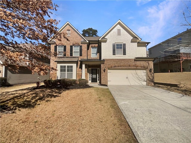 view of front facade with brick siding, concrete driveway, and an attached garage