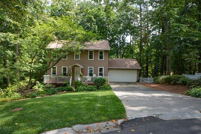 colonial home with a garage and a front lawn