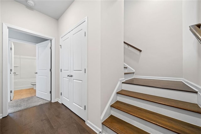 stairs with wood finished floors