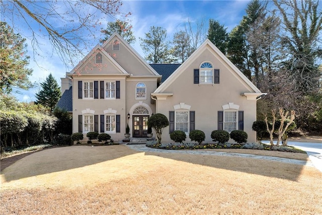 view of front of property featuring french doors and stucco siding