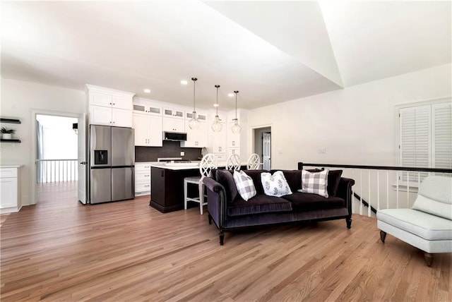 living room featuring recessed lighting and light wood finished floors