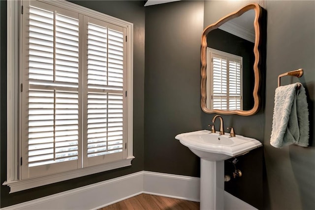 bathroom featuring baseboards and wood finished floors