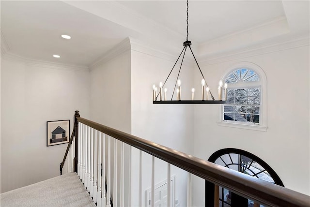 hallway featuring recessed lighting, an upstairs landing, a notable chandelier, and ornamental molding