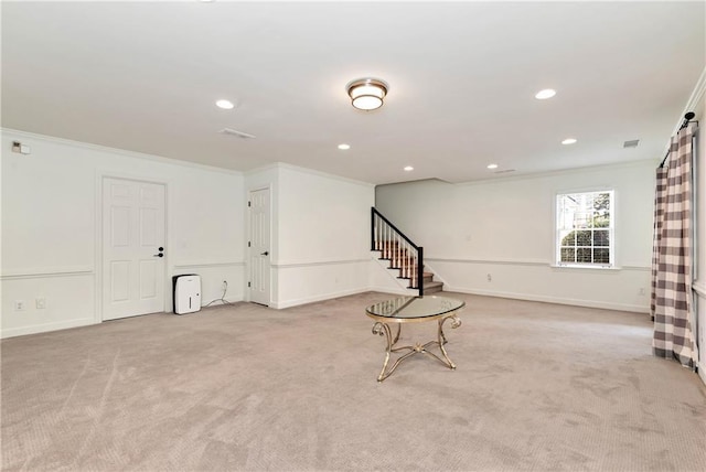 interior space featuring light colored carpet, stairs, and crown molding