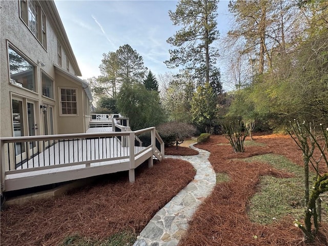 view of yard with a wooden deck