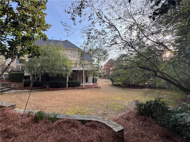 view of yard with stairs and a wooden deck