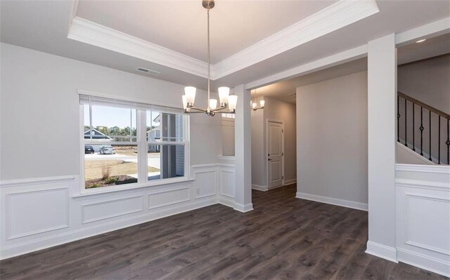 653 Forest Way, Cornelia, GA 30531 - unfurnished dining area featuring a chandelier, crown molding, a tray ceiling, a decorative wall, and dark wood finished floors
