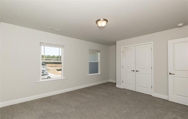 653 Forest Way, Cornelia, GA 30531 - unfurnished bedroom featuring carpet floors, baseboards, and a closet