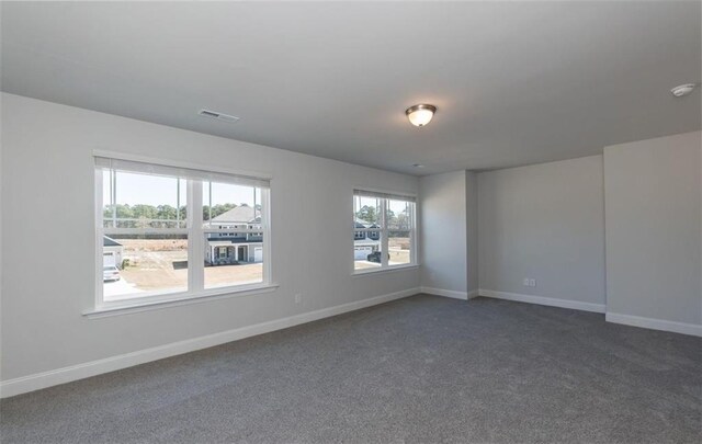 653 Forest Way, Cornelia, GA 30531 - spare room featuring dark carpet, baseboards, and a smoke detector