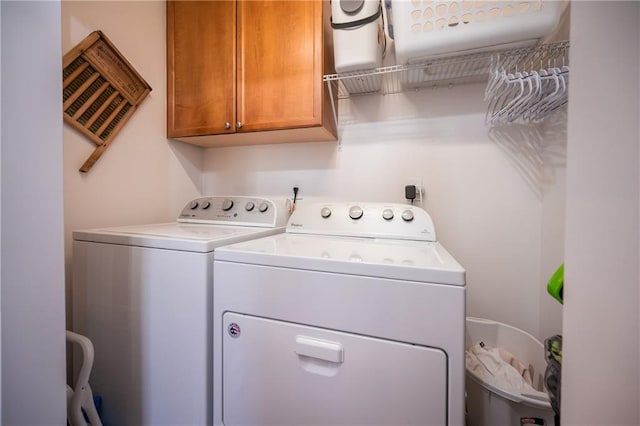 laundry area featuring cabinet space and washer and dryer