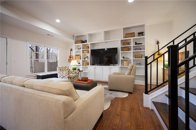 living area featuring dark wood-style floors, stairway, visible vents, and recessed lighting