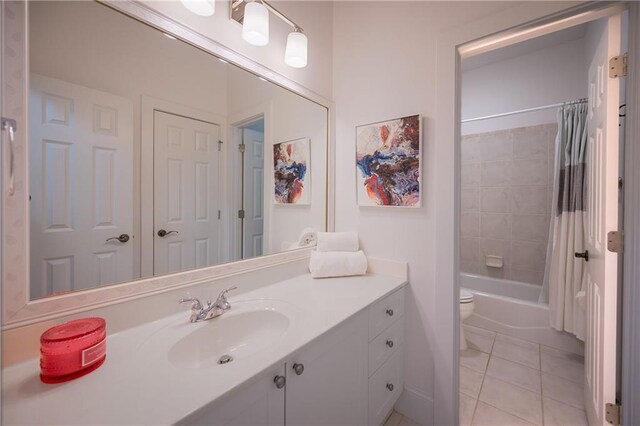 full bathroom featuring toilet, tile patterned flooring, vanity, and shower / bathtub combination with curtain