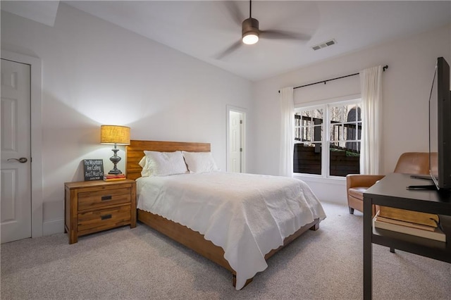 bedroom featuring carpet floors, visible vents, and a ceiling fan