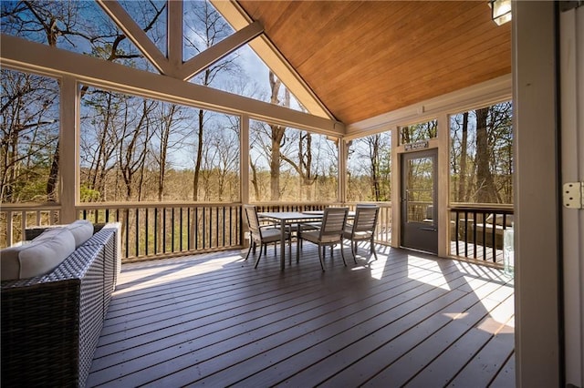 wooden terrace featuring outdoor dining area