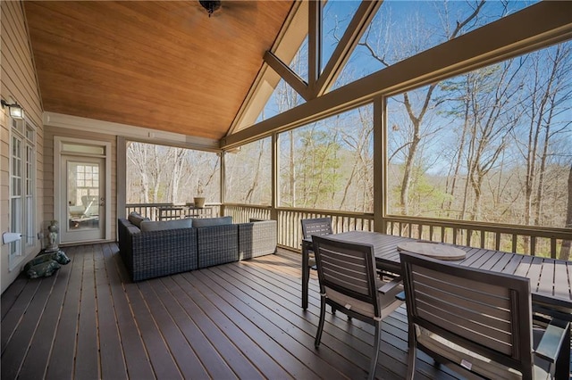 wooden terrace with outdoor dining space