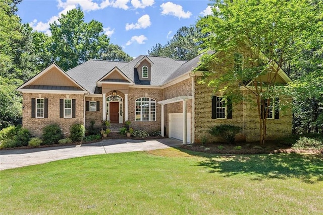 view of front of property with a garage and a front lawn