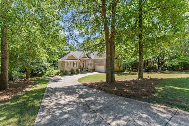 view of front facade with a garage and a front lawn