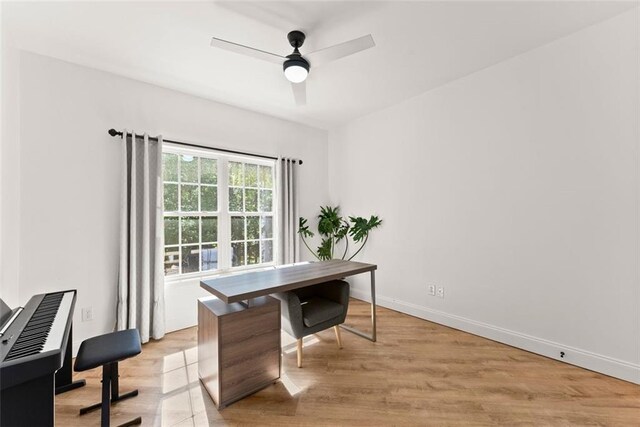 office space with ceiling fan and light wood-type flooring