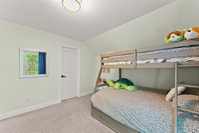 carpeted bedroom with vaulted ceiling