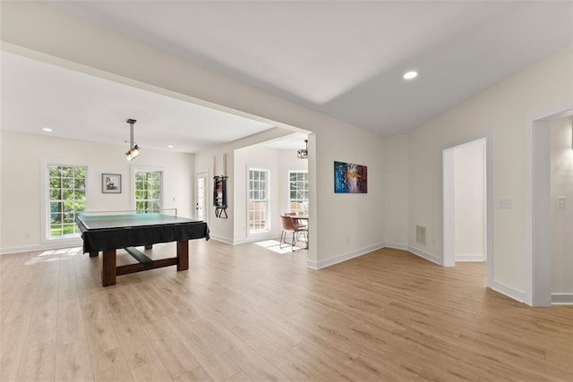 recreation room with a notable chandelier, pool table, and light hardwood / wood-style flooring