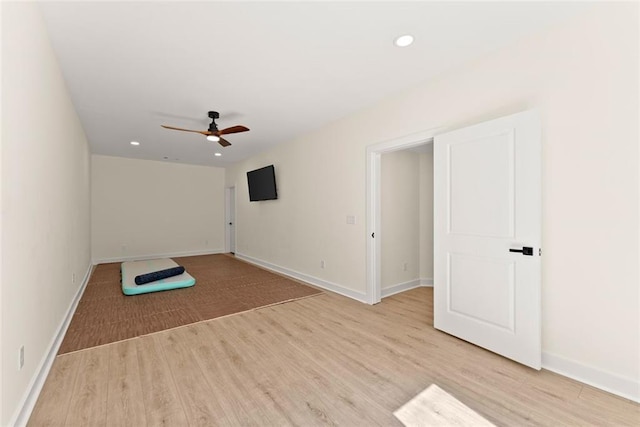 unfurnished room featuring ceiling fan and light hardwood / wood-style flooring