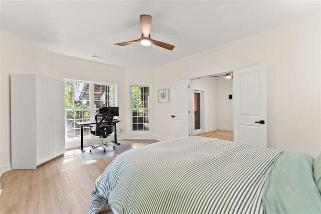 bedroom featuring ceiling fan and light hardwood / wood-style flooring