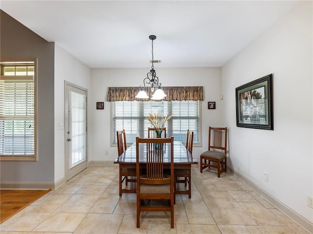 11 Stillwater Way, Hoschton, GA 30548 - dining space featuring a chandelier and baseboards