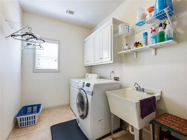 11 Stillwater Way, Hoschton, GA 30548 - washroom with washer and dryer, light tile patterned flooring, and cabinet space