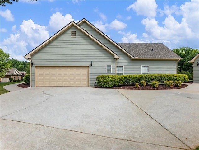11 Stillwater Way, Hoschton, GA 30548 - view of side of property with driveway and a garage