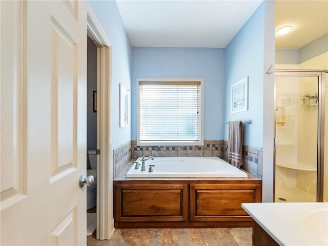 11 Stillwater Way, Hoschton, GA 30548 - bathroom featuring a garden tub, a shower stall, and vanity