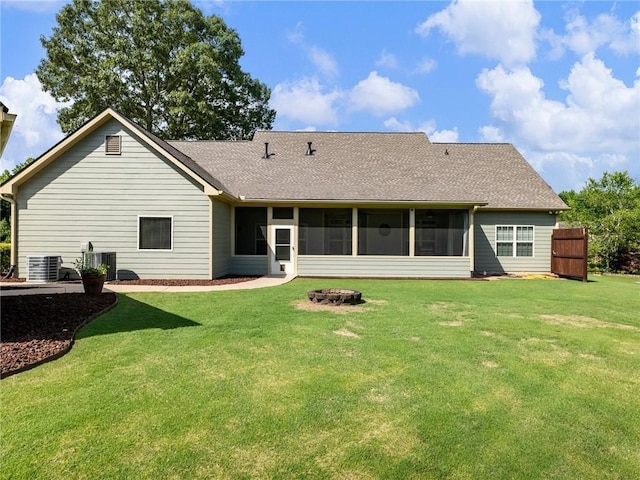 11 Stillwater Way, Hoschton, GA 30548 - rear view of property with a fire pit, a sunroom, roof with shingles, and a yard