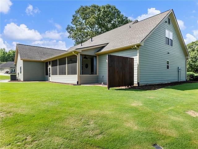 11 Stillwater Way, Hoschton, GA 30548 - back of house featuring a shingled roof, a sunroom, and ceiling fan