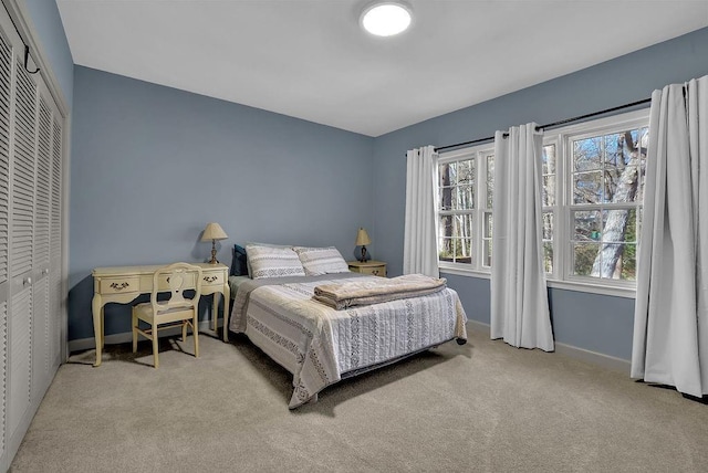 carpeted bedroom with a closet